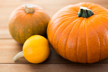 Image showing close up of pumpkins on wooden table at home