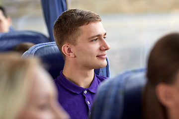 Image showing happy young man sitting in travel bus