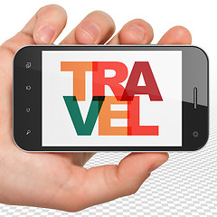 Image showing Tourism concept: Hand Holding Smartphone with Travel on  display