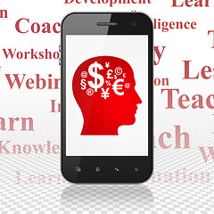 Image showing Education concept: Smartphone with Head With Finance Symbol on display