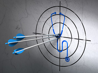 Image showing Healthcare concept: arrows in Stethoscope target on wall background