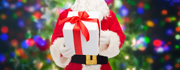 Image showing man in costume of santa claus with gift box