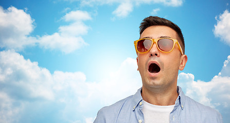 Image showing face of scared man in shirt and sunglasses