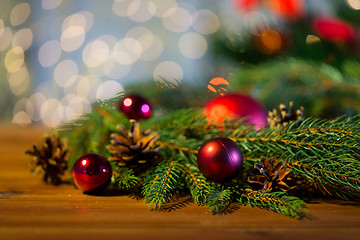 Image showing fir branch with christmas ball and pinecones