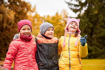 Image showing group of happy children hugging in autumn park