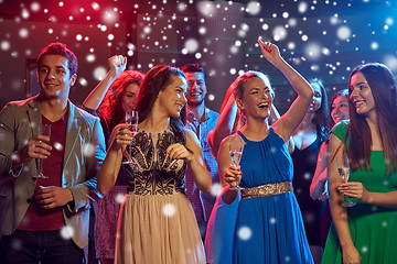 Image showing smiling friends with wine glasses and beer in club