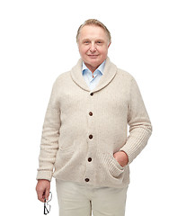 Image showing smiling senior man in cardigan