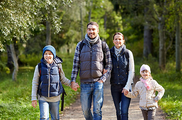 Image showing happy family with backpacks hiking