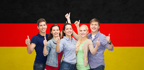 Image showing group of smiling students showing thumbs up