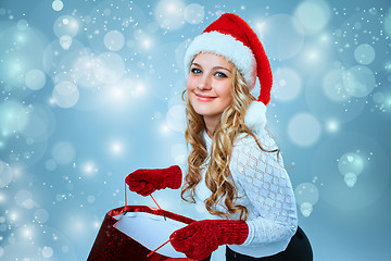 Image showing Beautiful young woman in Santa Claus clothes