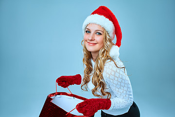 Image showing Beautiful young woman in Santa Claus clothes