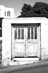 Image showing blue door in antique village santorini greece europe and    whit