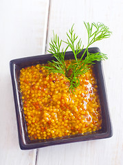 Image showing Mustard in the black bowl on table