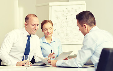 Image showing business people with papers meeting in office