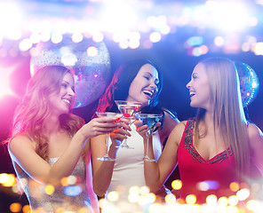 Image showing smiling women with cocktails at night club