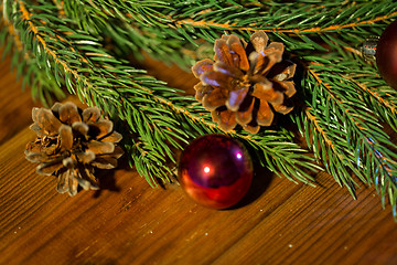 Image showing fir branch with christmas ball and pinecones