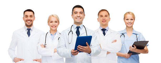 Image showing group of doctors with tablet pc and clipboard