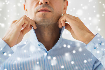 Image showing close up of man in shirt dressing