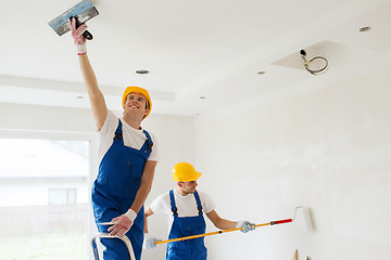 Image showing group of builders with tools indoors