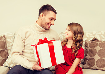 Image showing smiling father and daughter looking at each other