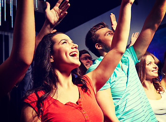 Image showing smiling friends at concert in club