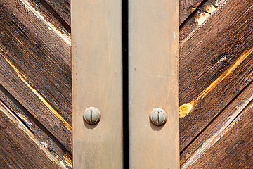 Image showing stripped paint  door    in italy   ancian wood and traditional  