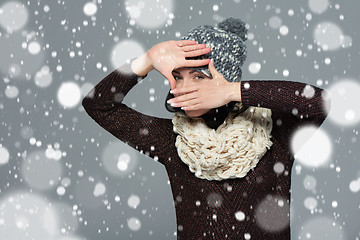 Image showing Woman in winter clothing making a frame with her hands