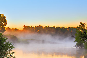 Image showing Early foggy morning and a small river.