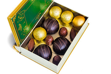 Image showing Chocolate sweets in the box on the white background.