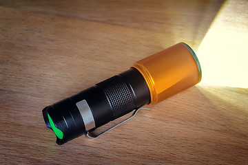 Image showing Included electric torch with a beam of light.