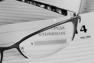 Image showing Glasses and notebook .