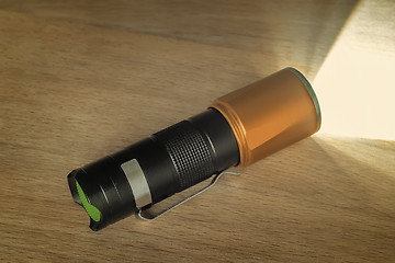 Image showing Included electric torch with a beam of light.