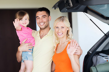 Image showing happy family with hatchback car at home parking