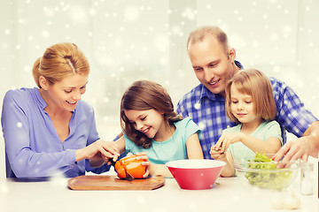 Image showing happy family with two kids making dinner at home