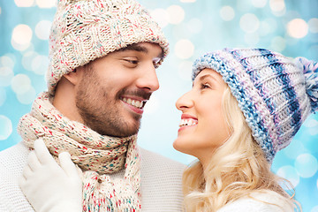 Image showing smiling couple in winter clothes hugging