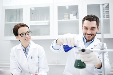 Image showing young scientists making test or research in lab