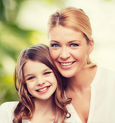 Image showing smiling mother and little girl