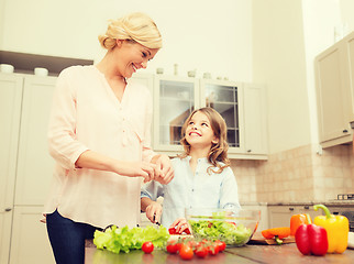 Image showing happy family making dinner in kitchen