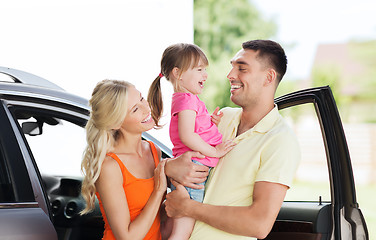 Image showing happy family with child laughing at car parking