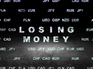 Image showing Currency concept: Losing Money in grunge dark room