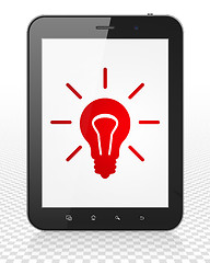 Image showing Finance concept: Tablet Pc Computer with Light Bulb on display