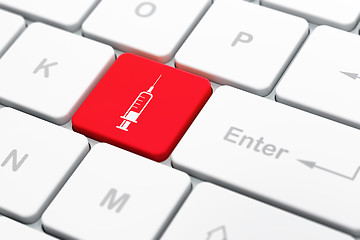 Image showing Medicine concept: Syringe on computer keyboard background
