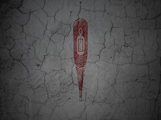 Image showing Healthcare concept: Thermometer on grunge wall background