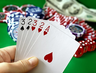 Image showing Card for poker in the hand, chips and card for poker