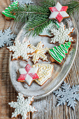 Image showing Tray of Christmas cookies and spruce branches.