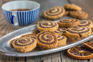 Image showing Cookies in the form of a spiral and a cup of tea.