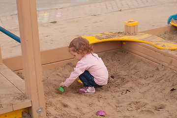 Image showing girl in a sandbox