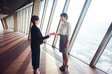 Image showing business woman group assembling jigsaw puzzle