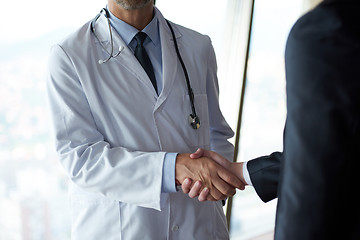 Image showing doctor handshake with a patient