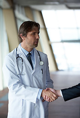 Image showing doctor handshake with a patient